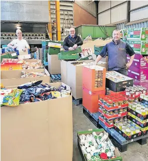  ?? ?? Generous donations Some of the masons with donated goods