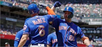  ??  ?? New York Mets’ Pete Alonso (right) celebrates with Jeff McNeil (6) after hitting a three-run home run off San Francisco Giants’ Derek Holland in the sixth inning of a baseball game on Saturday in San Francisco. AP Photo/BEN mARgot