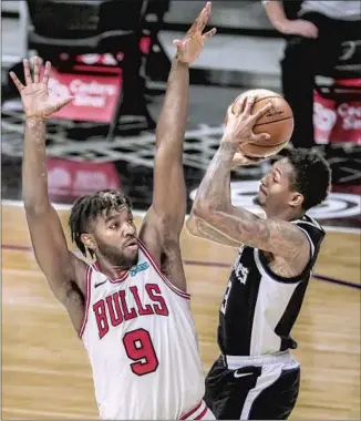  ?? Robert Gauthier Los Angeles Times ?? LOU WILLIAMS scored a season- high 21 points Sunday against Patrick Williams and the Bulls. The Clippers “need him to score and be Lou Williams,” teammate Paul George said.
