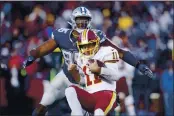  ?? JOE ROBBINS — GETTY IMAGES, FILE ?? Former Cowboy David Irving (95) sacks Washington’s Alex Smith during their 2018 game in Landover, Maryland. Irving on Tuesday signed with the Raiders.