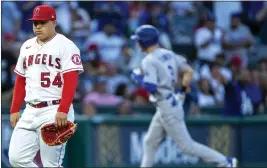  ?? ALEX GALLARDO – THE ASSOCIATED PRESS ?? Angels pitcher Jose Suarez huffs with the Dodgers' Trea Turner on a home run trot.