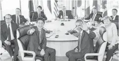  ?? Associated Press ?? President Barack Obama, clockwise from center right, Japanese Prime Minsiter Shinzo Abe, French President Francois Hollande, British Prime Minister David Cameron, Canadian Prime Minister Justin Trudeau, European Commission President Jean-Claude...