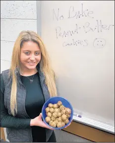  ?? PHILIP POTEMPA/POST-TRIBUNE ?? Paige Seely, 18, a student at Purdue University Northwest, makes an easy no-bake peanut butter cookie that is an easy and ideal summer treat, especially during extreme temperatur­e months.