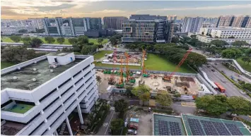  ?? SAMUEL ISAAC CHUA/THE EDGE SINGAPORE ?? The site of the former Certis Cisco Centre, where a new 12-storey building will be built, while an existing eight-storey building (left) will be retrofitte­d