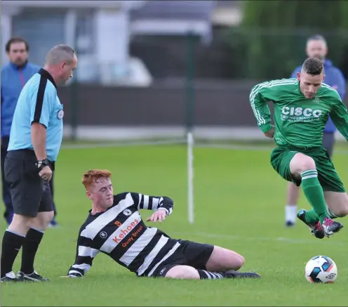  ?? Picture: Ken Finegan ?? Barry Kavanagh, Duleek, skips past Cody Magill of Quay Celtic at Clancy Park on Friday evening.