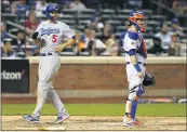  ?? NOAH K. MURRAY — THE ASSOCIATED PRESS ?? The Dodgers’ Corey Seager scores the go-ahead run against the Mets on a double by Cody Bellinger during the 10th.
