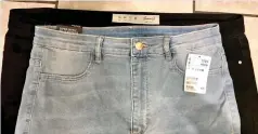  ??  ?? Same size? H&amp;M jeans on top of the black Primark pair