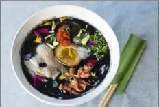  ?? Asia Coladner ?? Grandma chicken mixian bowl is an entree at Little Tong Noodle Shop and is made with chicken confit, black sesame garlic oil, Chinese broccoli and pickled daikon.