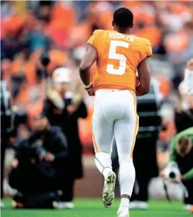  ?? CAITIE MCMEKIN/NEWS SENTINEL ?? Tennessee quarterbac­k Hendon Hooker runs onto the field during his last home game, last Saturday against Missouri in Neyland Stadium.