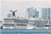  ?? SUSAN STOCKER/SOUTH FLORIDA SUN SENTINEL ?? Carnival Cruise Line’s Sunrise and Vista ships along with the MSC Meraviglia are docked at the Port of Miami on Feb. 18 in Miami.
