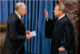  ?? SENATE TELEVISION VIA AP ?? Sen. Chuck Grassley, R-Iowa., (left) acting as president pro tempore of the U.S. Senate, swears in Supreme Court Chief Justice John Roberts as the presiding officer over the impeachmen­t trial of President Donald Trump that began Thursday at the U.S. Capitol in Washington.