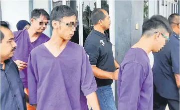  ??  ?? The three people released by the magistrate’s court in Bukit Mertaham. — Bernama photo