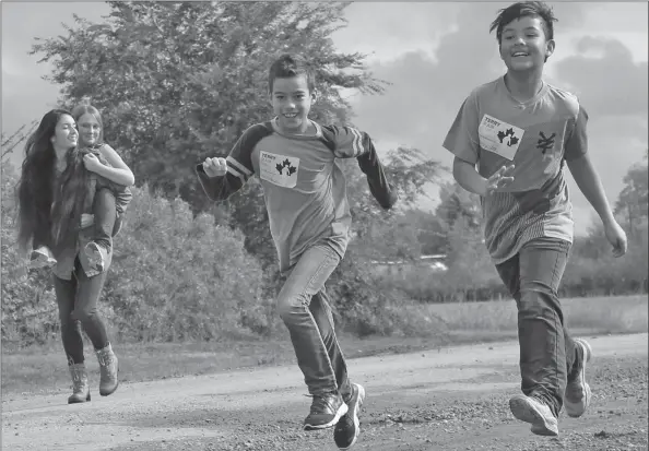  ?? Palliser Schools photo ?? DOING IT FOR TERRY AND THOSE WHO H A V E SUFFERED: Coalhurst Elementary School students joined with their counterpar­ts from Coalhurst High School for this year’s Terry Fox Run. For more on the Terry Fox Run and