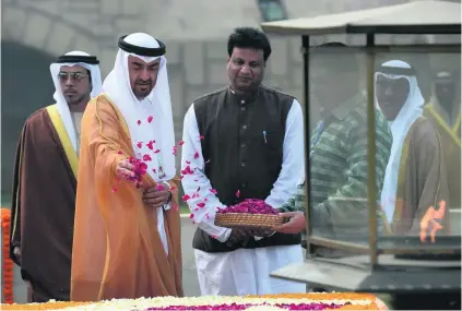  ?? Prakash Singh / AFP ?? Sheikh Mohammed bin Zayed, Crown Prince of Abu Dhabi and Deputy Supreme Commander of the Armed Forces, pays a floral tribute yesterday at Raj Ghat, the memorial to Mahatma Gandhi in New Delhi.