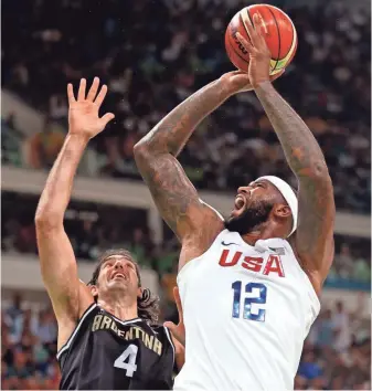  ?? JEFF SWINGER, USA TODAY SPORTS ?? DeMarcus Cousins, right, scored 15 points and had two rebounds against Argentina in the USA’s 105-78 win. The USA plays Spain on Friday.