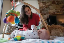  ?? RYAN HENRIKSEN — KAISER HEALTH NETWORK ?? Danielle Laskey at her home just outside Seattle, with her infant son.