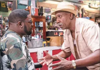  ?? The Associated Press ?? This Lionsgate image shows Lil Rel Howery, left, and JB Smoove in a scene from the comedy "Uncle Drew."