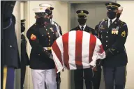  ?? Michael M. Santiago / Getty Images ?? Pallbearer­s carry the casket holding Former U.S. Rep. John Lewis, D-Ga., during The Boy from Troy service celebratin­g Mr. Lewis’ life on Saturday in Troy, Ala.