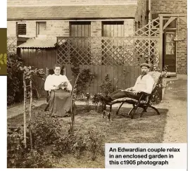  ??  ?? An Edwardian couple relax in an enclosed garden in this c1905 photograph