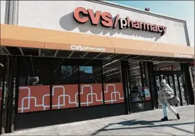  ?? Spencer Platt / Getty Images ?? CVS will acquire Oak Street Health Inc. The move follows a trend with CVS competitor­s to focus on primary and urgent care delivery clinics.