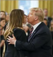  ?? PATRICK SEMANSKY - THE ASSOCIATED PRESS ?? President Donald Trump kisses First Lady Melania Trump in the East Room of the White House in Washington, Thursday, Feb. 6.