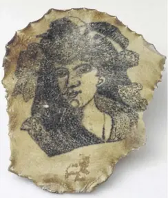  ?? PICTURE: WELLCOME COLLECTION. ?? A 19th century tattoo shows a face. Tattoos were likely to use gunpowder, charcoal or ashes mixed with water, saliva or urine