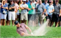  ?? Reuters ?? Brooks Koepka hits a bunker shot on the second hole during the second round of the Northern Trust golf tournament. —