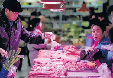  ?? Picture: REUTERS ?? DISEASE SCARE: China’s huge pork industry is threatened by a spreading African swine flu outbreak