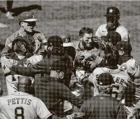  ?? Carlos Avila Gonzalez / San Francisco Chronicle ?? The Athletics and Astros got into a benches-clearing brawl in the seventh inning after Ramon Laureano (22) was hit by a pitch from Humberto Castellano­s (72).