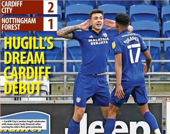  ?? ?? Cardiff City’s Jordan Hugill celebrates with team-mate Cody Drameh after scoring his side’s first goal yesterday