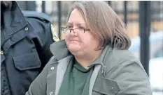  ?? DAVE CHIDLEY/THE CANADIAN PRESS ?? Elizabeth Wettlaufer is escorted into the courthouse in Woodstock, Ont. on Friday, Jan. 13, 2017. Newly released court documents show a former Ontario nurse accused of killing eight seniors in her care had been suspended from a long-term care home...