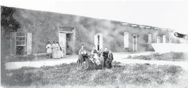  ?? COURTESY BERNALILLO COUNTY ?? The Gutierrez family poses on the front lawn of their home in the mid 1800s. The house is still standing today.