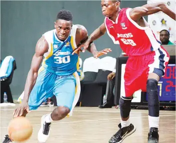  ??  ?? Lagos Warriors and Lagos City Stars battling for points in a Continenta­l Basketball League game held at the Teslim Balogun Stadium… at the weekend.