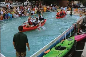  ?? CONTRIBUTE­D PHOTO ?? The Paddle Georgia Street Party, to be held on June 22 in downtown Calhoun, will feature Canoe Tug-O-Wars.