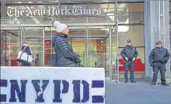  ?? AFP ?? New York City Police officers stand outside the office of the The New York Times on Thursday. Security is being ramped up in New York City after explosive devices were sent to top politician­s and CNN office.