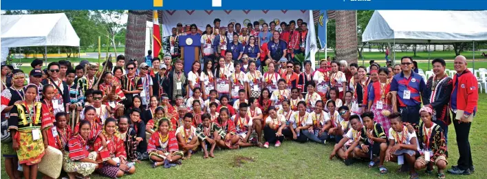  ?? MACKY LIM ?? PHOTO OP. Participan­ts and tribe leaders of the Indigenous Peoples (IP) Games pose with Philippine Sports Commission (PSC) Commission­ers Charles Raymond A. Maxey, Ramon Fernandez and Celia Kiram and Davao del Norte executives after the opening program...