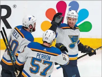  ?? JOSIE LEPE/AP PHOTO ?? Ryan O’Reilly (90) and David Perron (57) of the St. Louis Blues celebrate with Jaden Schwartz (17) after a goal by Schwartz in the third period of Sunday’s NHL playoff game against the San Jose Sharks at San Jose, Calif. The Blues won 5-0 to take a 3-2 series lead.