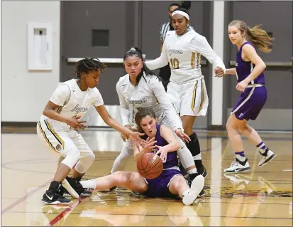  ?? CHRIS RILEY — TIMES-HERALD ?? Bethel High’s Jhrriuha Pina, left, and Meriel Ferrer steal the ball from Petaluma’s Taylor Iacopi during the Jaguars’ 46-44win in the North Coast Section Division II playoffs on Tuesday.