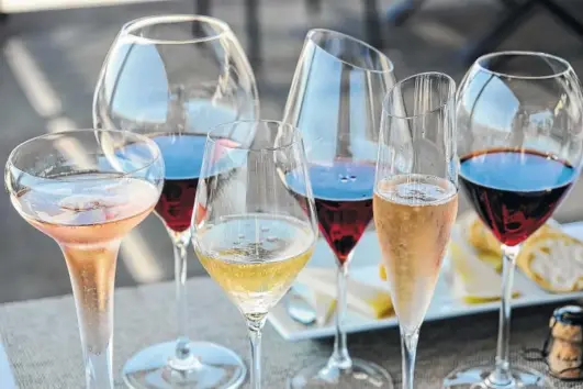  ?? PHOTOS BY ERIC RISBERG/THE ASSOCIATED PRESS ?? Different-shaped glasses of wine are displayed on the terrace at Gloria Ferrer Caves & Vineyards in Sonoma, Calif.