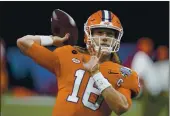  ?? GERALD HERBERT — THE ASSOCIATED PRESS ?? Clemson quarterbac­k Trevor Lawrence warms up before the Sugar Bowl against Ohio State last week.