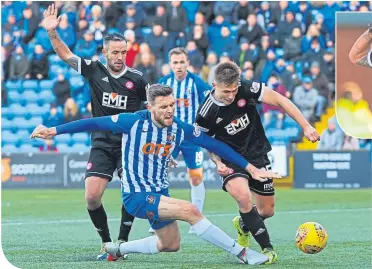  ??  ?? Killie’s O’Donnell is challenged by Hamilton’s Martin