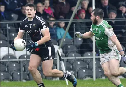  ??  ?? Pat Hughes sets up a Sligo attack. Pics: Tom Callanan.