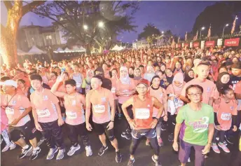  ??  ?? File photo shows participan­ts before the start of the Kuching Marathon 2019 at Padang Merdeka.