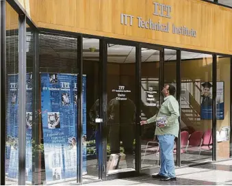  ?? James Nielsen / Houston Chronicle ?? ITT student Hafeez Syed arrives Tuesday to find locked doors at the Houston West campus on Gessner.