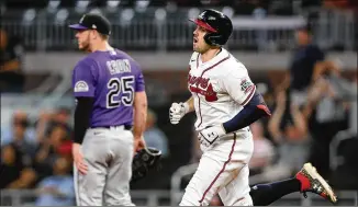  ?? CURTIS COMPTON / CURTIS.COMPTON@AJC.COM ?? Braves outfielder Adam Duvall rounds the bases after hitting a two-run homer in the eighth inning to cut the Colorado Rockies’ lead to 5-4 Tuesday in Atlanta.