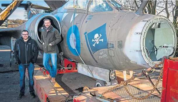  ?? ?? ATTRACTION: Scottish Deer Centre owners Gavin Findlay and David Hamilton with their £28,000 jet. Picture by Steve Brown. Below, the Buccaneer being transporte­d on its way to Fife from Elgin.