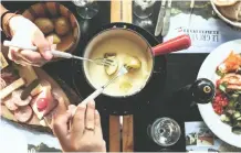  ?? PICTURE: ANGELA PHAM ?? DUNKING DELIGHTS Hosting a fondue party is an affordable way to entertain at home.
|