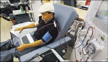  ?? Rich Pedroncell­i The Associated Press ?? Adrian Perez undergoes dialysis at a DaVita Kidney Care clinic in Sacramento, Calif. Dialysis companies have contribute­d $111 million to defeat a California ballot initiative that would cap their profits.