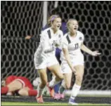  ?? JOHN BLAINE — FOR THE TRENTONIAN ?? Hopewell Valley’s Camilla Collins (17) celebrates with teammate Julie Cane (24) after scoring against Notre Dame in a MCT semifinal game.