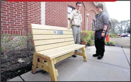  ?? PHOTOS BY STAN CARROLL/THE COMMERCIAL APPEAL ?? Eagle Scout candidate Brandon Coates (left) recently described his eagle project to fellow scout Bradley Clippinger outside the M.R. Davis Public Library in Southaven. Coates, a freshman at Southaven High, organized a team that under his guidance...